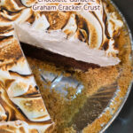 A Pinterest pin for an s'mores pie recipe. The image shows a close-up angled view of a s'mores pie with a slice removed, revealing a dark chocolate ganache filling, a graham cracker crust, and a tall toasted marshmallow fluff topping with golden brown char marks, with the Doggone Baking logo in the bottom right corner. Text overlay reads "S'more Pie | Homemade Marshmallow Fluff | Chocolate Ganache | Graham Cracker Crust."