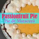 Overhead view of a passionfruit pie with a golden yellow passion fruit custard filling and piped whipped cream rosettes around the border in a Biscoff cookie crust. Text overlay reads "Passionfruit Pie, Pie de Maracuyá" with the Doggone Baking logo and tagline "everything pie."